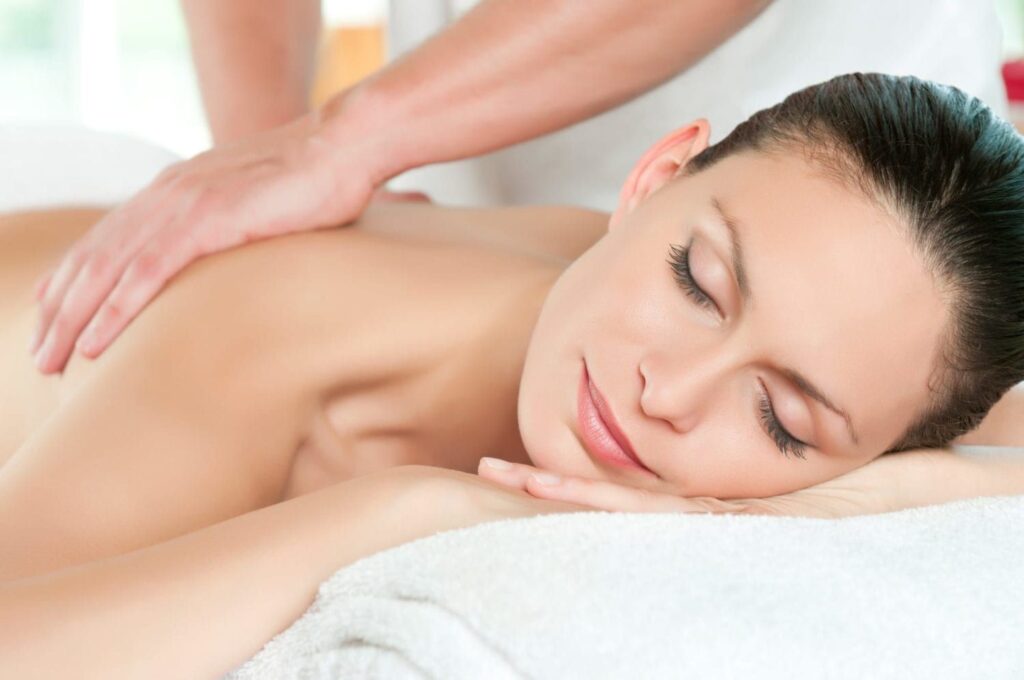 A woman is getting a massage at a spa.